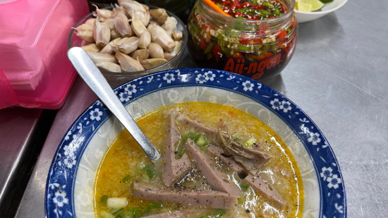 Strips of beef sausage on top of the rice porridge