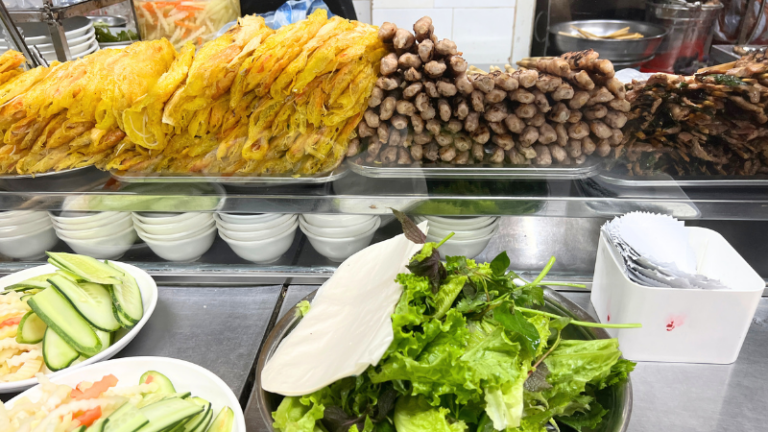 Grilled pork skewer and banh xeo (yellow crepe)