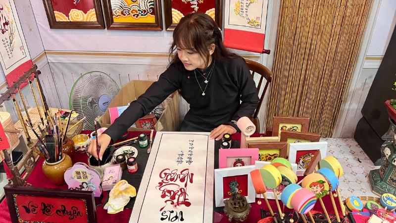 Calligrapher preparing customized message on scroll